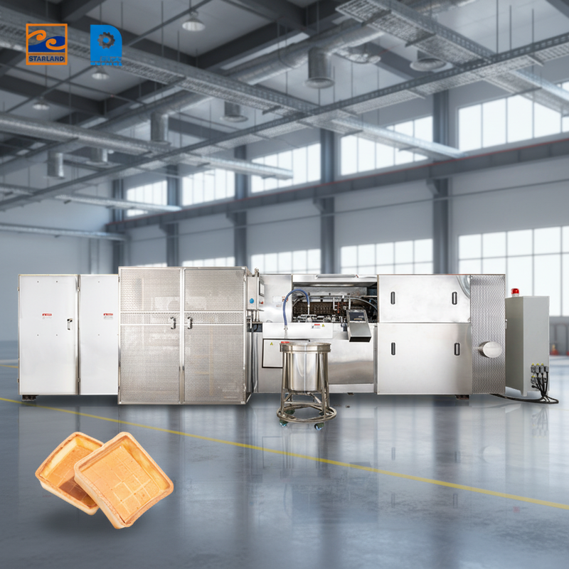 Ligne de production automatique de coquilles de tartre comprenant un support technique vidéo conçu pour la production et l'uniformité du produit